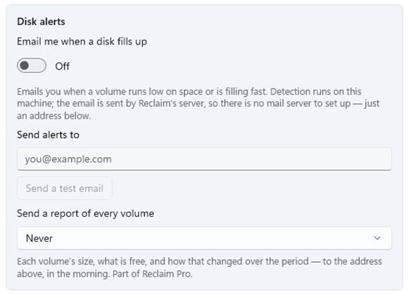 The Disk alerts card: the switch, the alert address, Send a test email, and the report of every volume - never, every week on Monday, every month on the 1st